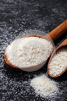 Portion of Psyllium Seeds on rustic dark background. Psyllium se