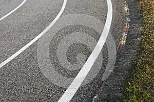 Race Track - tarmac, kerb and three lines photo