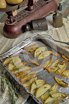 Portion of roasted potato, seasoned with rosemary