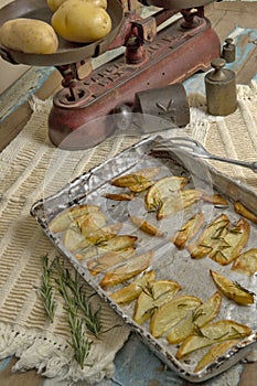 Portion of roasted potato, seasoned with rosemary