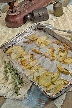 Portion of roasted potato, seasoned with rosemary