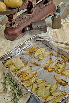 Portion of roasted potato, seasoned with rosemary