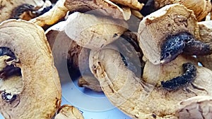 Portion of rotating dried mushrooms. Agaricus campestris