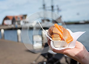 Portion of salmon sandwich sold in The Netherlands as a street snack food and called broodje zalm in dutch