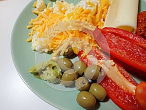 Portion of scrambled eggs with vegetables photo