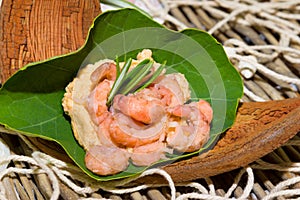 Portion of shrimps on a nasturtium leaf