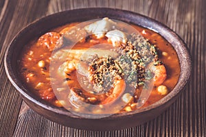 Portion of Spanish fish and chorizo soup photo