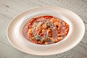 Portion of Spanish fish and chorizo soup
