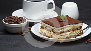 Portion of Traditional Italian Tiramisu dessert, cup of espresso, milk , brown sugar and coffee