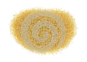 Portion of turbinado sugar isolated on a white background