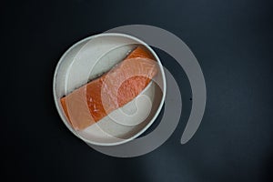 Portioned raw salmon fillets