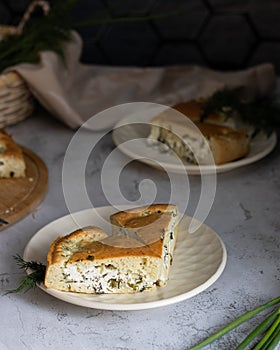 portioned rustic pie with cottage cheese and herbs