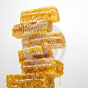 Portions of fresh honeycomb on a white background. vitamin natural food. bee work product