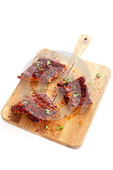 Portions of spicy BBQ ribs photo