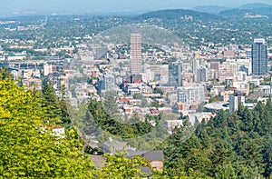PORTLAND, OR - AUGUST 19, 2017: City aerial skyline from the hill. The city attracts 5 million people annually