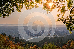 Portland Downtown and Mt Hood with sunshine behind autumn foliage