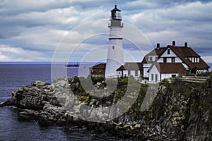 Portland Head Lighthouse in Maine under cloudy skies