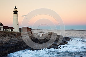 Portland Lighthouse Guides Fishing Vessel at Dusk in Maine
