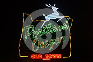Portland Oregon sign with jumping deer during night