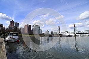 Portland, Oregon / USA - Circa 2019: Portland Oregon skyline seen from a pier on the Willamette River