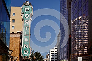 Portland sign from 30's on brick building in Portland, Oregon, USA with clear blue sky