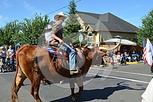 Portland, USA - July 4, 2012: Men on cow parade in Independence