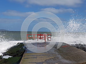 Portmarnock rocky beach on a sunny windy day