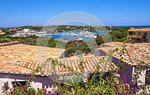 Porto Cervo, Sardinia, Italy - Panoramic view of luxury yacht port, marina and residences of Porto Cervo resort at the Costa