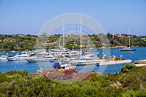 Porto Cervo, Sardinia, Italy - Panoramic view of luxury yacht port, marina and residences of Porto Cervo resort at the Costa