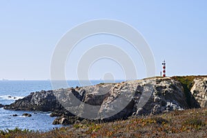 Porto cÃ´vo lighthouse over the cliff