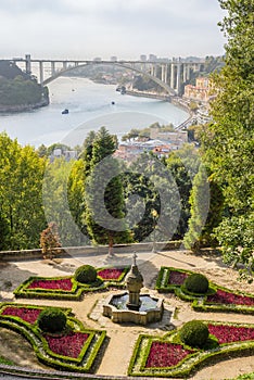 Porto Oporto town with Arrabida bridge over Douro river and floral garden park