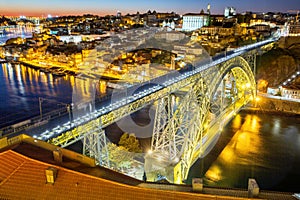 Porto Portugal with bridge Ponte Dom Luis I Douro river town travel at twilight