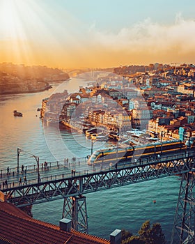 Porto, Portugal Dom Luis Iron Bridge at sunset featuring Douro River, Metro Train and Port Wine Boats