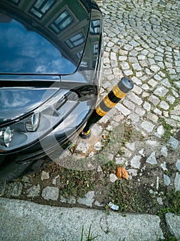 Porto, Portugal - October 4, 2020 car ran over and bent an anti-parking pole, an accident in the city