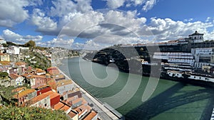 Porto, Portugal old town ribeira aerial promenade view with colorful houses, Douro river and boats