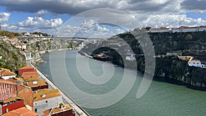 Porto, Portugal old town ribeira aerial promenade view with colorful houses, Douro river and boats