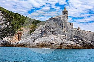 Porto Venere, Italy with church of St. Peter on cliff.