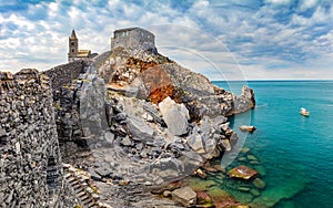 Porto Venere, Italy with church of St. Peter on cliff.