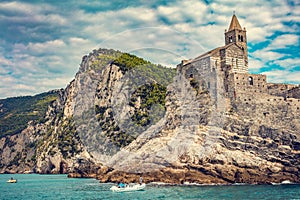 Porto Venere, Italy with church of St. Peter on cliff.