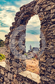 Porto Venere, Italy with church of St. Peter seen from ancient window