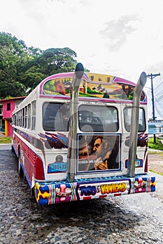 PORTOBELO, PANAMA - MAY 28, 2016: Colorful chicken bus, former US school bus. in Portobelo village, Pana