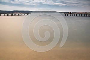 PortoroÃâ¦ÃÂ¾, Slovenia - May 26, 2019 - people relaxing on wooden footbridge pier in PortoroÃâ¦ÃÂ¾ on adriatic coastline