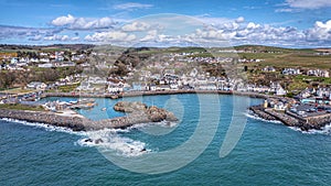 Portpatrick harbour, Scotland with docked boats along the shore