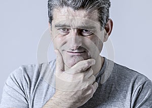 Portrait of 40s to 50s sad and worried man looking frustrated an