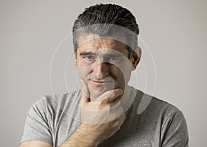 Portrait of 40s to 50s sad and worried man looking frustrated and hopeless in stress and sorrow face expression isolated