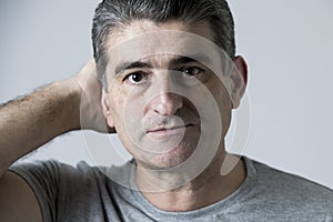 Portrait of 40s to 50s sad and worried man looking frustrated and hopeless in stress and sorrow face expression isolated