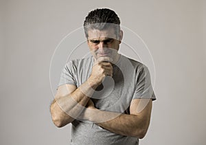 Portrait of 40s to 50s sad and worried man looking frustrated and hopeless in stress and sorrow face expression isolated