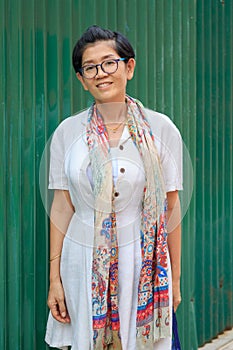 Portrait of 45s years asian woman standing with toothy smiling f