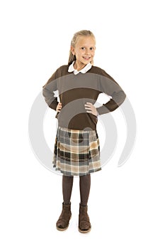 Portrait of 7 or 8 years old beautiful and happy schoolgirl female child in school uniform smiling cheerful isolated on white back