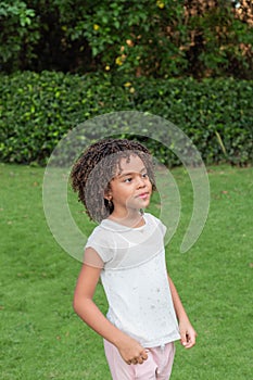 Portrait of 7 years old girl standing outdoors